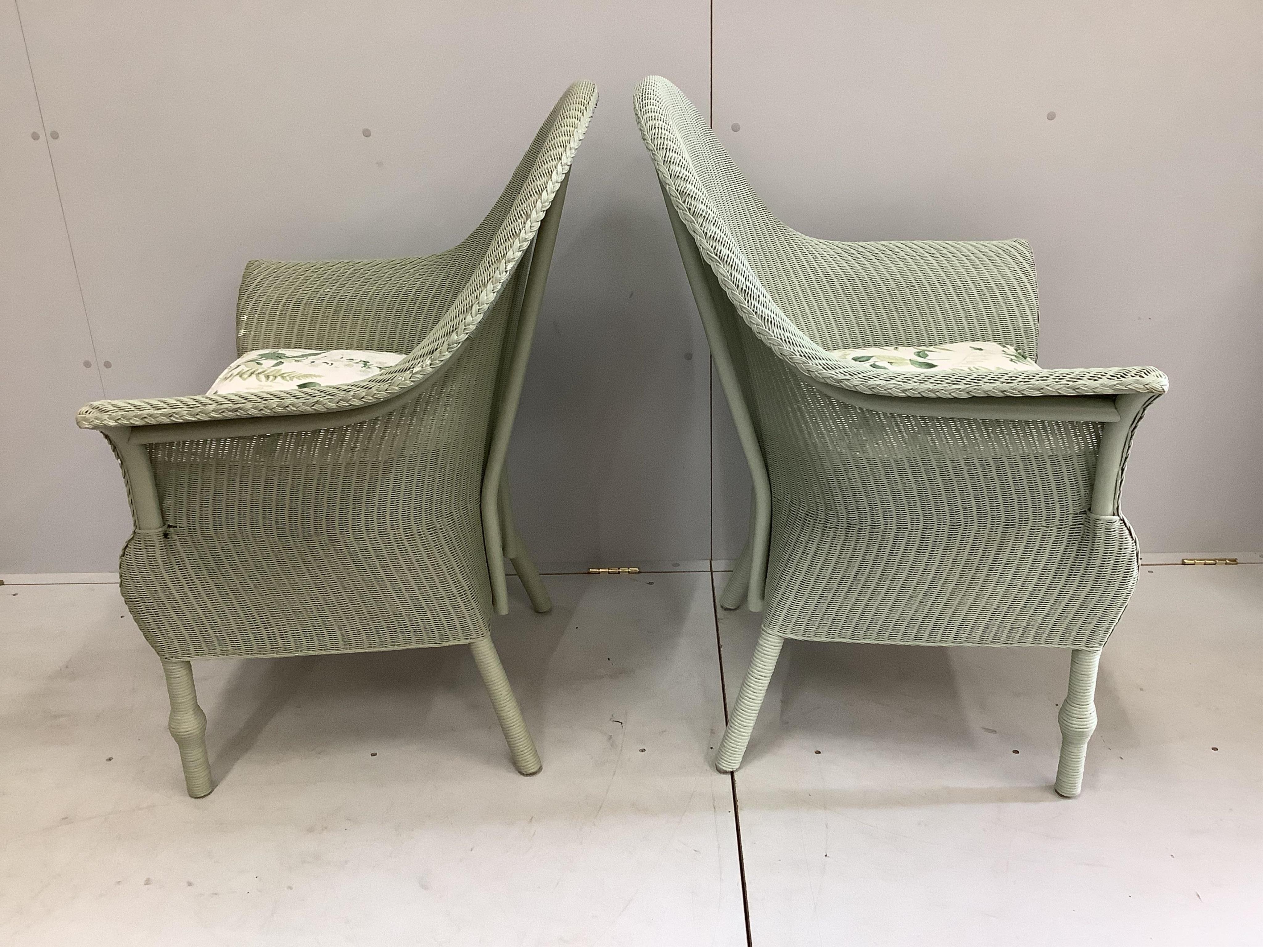 A pair of modern 'Lusty' Lloyd Loom armchairs with loose cushion seats, width 75cm, depth 60cm, height 102cm. Condition - good